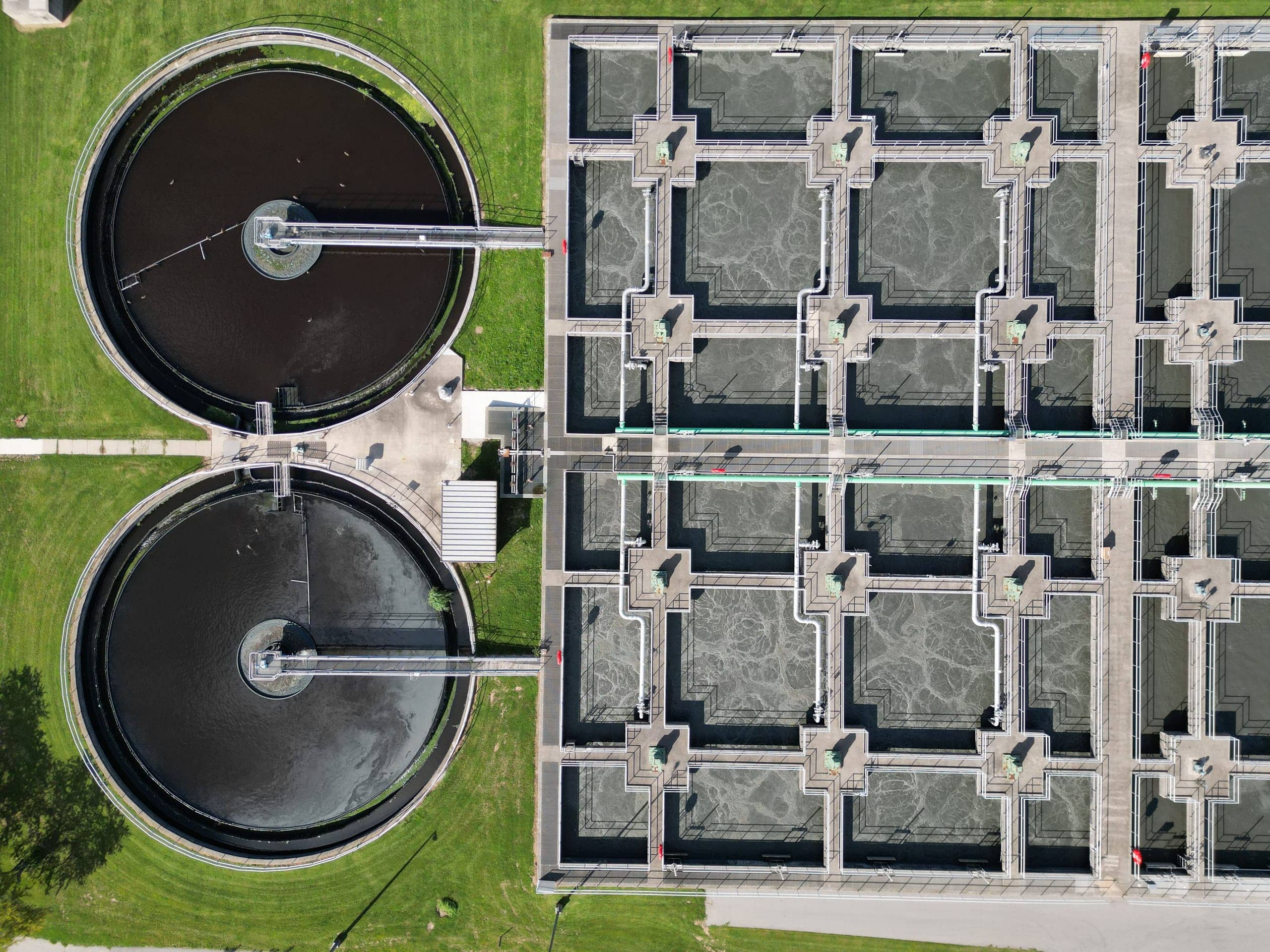 Aerial view of a water treatment facility with clarifiers and filter basins